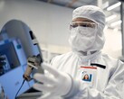 Intel aims for foundry break-even in 2027 as 18A node enters volume ramp. Pictured: A worker holding a silicon wafer (Image source: Intel)