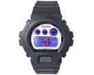 Casio G-Shock DW-6900 x F.C. Real Bristol with the blue EL backlight illuminated, revealing a hidden red Bristol logo behind the digital display.