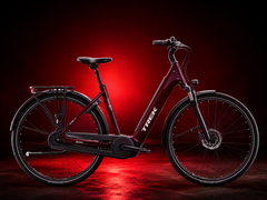 The District+ e-bike in cobra blood colorway