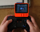 Gaming on Rabbit R1 isn't that bad if you have a wireless controller and don't mind the tiny screen (image source: Bringus Studios)