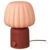 The IKEA Kulglass Bluetooth speaker lamp in red brown/pink. (Image source: IKEA)