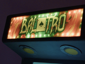Balatro logo on an arcade machine