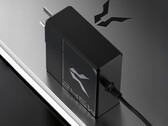 The Bellator 245W laptop charger has a round 5525 DC plug. Pictured: the power adapter on top of a laptop.