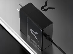 The Bellator 245W laptop charger has a round 5525 DC plug. Pictured: the power adapter on top of a laptop.