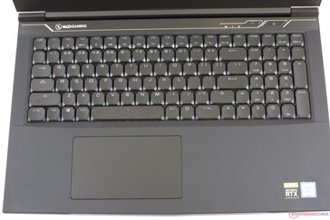 Standard keyboard key layout. The dark gray font color doesn't contrast very well against the black key caps. Most other laptops have white font instead