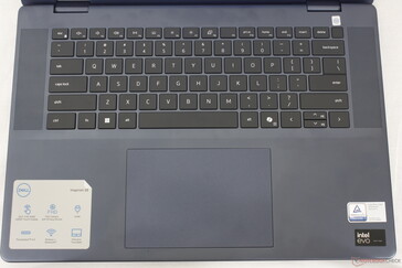 QWERTY layout with speaker grilles along the sides