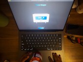 The MacBook Pro's trackpad can weigh small objects. (Image source: Krish Shah)