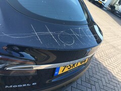 A defaced Tesla Model S. Elon Musk proposes Tesla cars can raise the alarm to prevent keying (Image source: John Vermetten via Autogespot)