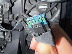 The burnt 12VHPWR power connector on the Sapphire Nitro+ RX 9070 XT. (Image source: r/pcmasterrace)