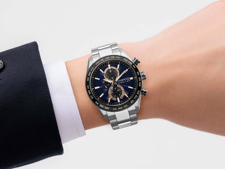 Citizen Attesa AT8297-51L chronograph worn on a wrist, showing its navy dial, rose-gold accents, and black world-time bezel.