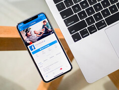 A phone with the Facebook app displayed on the screen. Stock image. (Image source: Timothy Hales Bennett on Unsplash)