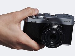 Fujifilm X-E4 compact APS-C camera in hand