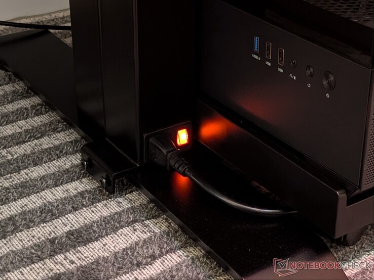 Power supply column mounted in front of the right leg due to proximity to wall outlet.