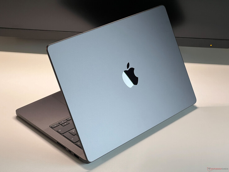 Apple MacBook Pro in Space Grey placed on a desk with the lid partially open, showing the keyboard and Apple logo (Image source: Notebookcheck)