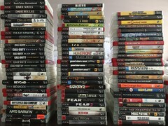 A collection of physical PS3 games pictured