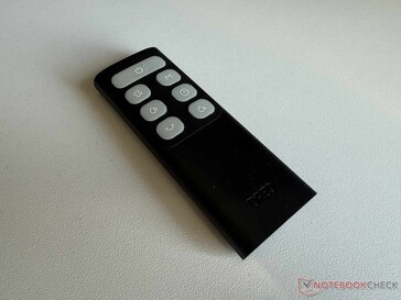 Compact remote control with fluorescent buttons