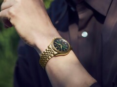 Seiko Presage Classic x Tradman’s Bonsai watch worn on a wrist, featuring a gold-tone case and bracelet and a dark green dial.