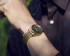 Seiko Presage Classic x Tradman’s Bonsai watch worn on a wrist, featuring a gold-tone case and bracelet and a dark green dial.