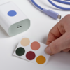 The IKEA Sjöss 65W 1-port USB charger can be customized with the accompanying stickers. (Image source: IKEA)