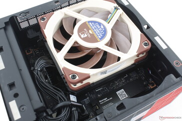 Removing the main side panel reveals the fan and primary M.2 SSD slot