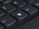 Close-up of a black laptop keyboard with the Windows key in focus