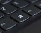 Close-up of a black laptop keyboard with the Windows key in focus