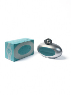 Silver and teal capsule-shaped collector's case for the Casio G-Shock x C2H4 collaboration.