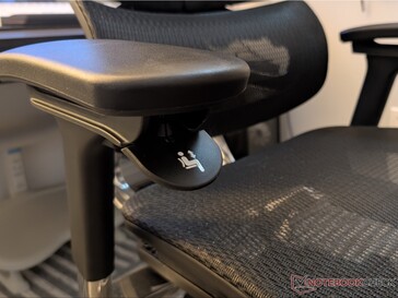 Seat height adjustment below the right armrest.