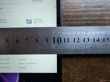 Narrow side bezels with thicker top and bottom bezels