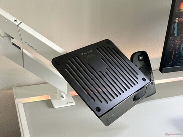 The laptop mount requires an additional monitor arm.