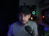 Content creator in a home studio with microphone and camera, illustrating the YouTube Partner Program