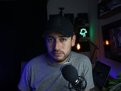 Content creator in a home studio with microphone and camera, illustrating the YouTube Partner Program
