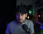 Content creator in a home studio with microphone and camera, illustrating the YouTube Partner Program