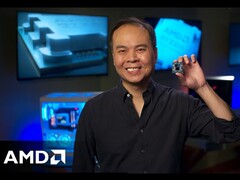 AMD SVP and GM Jack Huynh holding up a Ryzen gaming CPU.