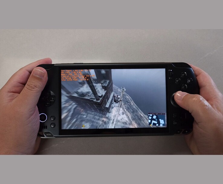 Close-up of GPD Win 5 handheld running Spider-Man with benchmark overlay visible on screen. (Image source: The Phawx via YouTube)