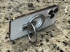 The magnetic ring can detach and serve as a kickstand.