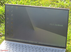 The ZenBook outdoors (sunny weather; indirect sunlight from behind the screen)