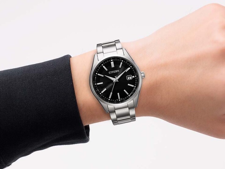 A person wearing the black dialed Citizen-CB0300-53E on their wrist.