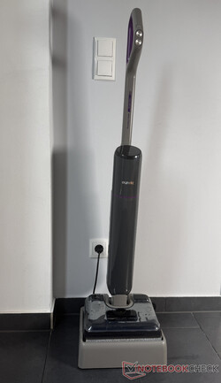 Eureka FloorShine 830 at its charging and self-cleaning station.