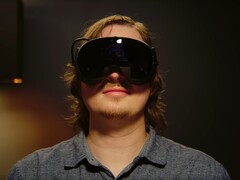 Gamer shown wearing Steam Frame VR headset