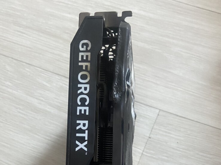 Top view of melted backplate of an EmTek StormX Dual RTX 4060 Ti GPU. (Image source: user_634494 on Quasar Zone)
