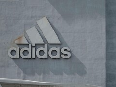 Adidas logo on a company wall (Image source: H&amp;CO/Pexels)