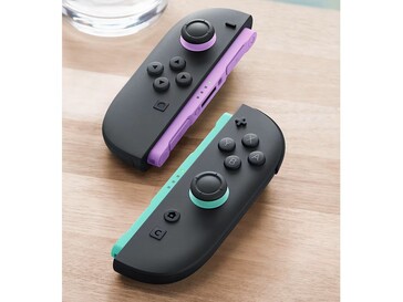 The new Joy-Cons have light purple and light green accents on the rails and joysticks. (Image source: Nintendo)