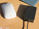 The Surface Mouse next to the Surface Pro 6’s 44 W charger