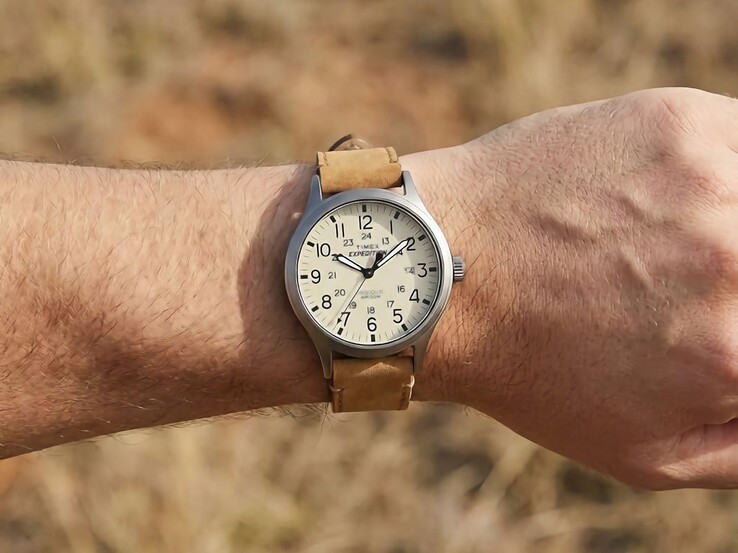 Timex Expedition Scout 40mm with a beige dial and leather strap worn on a wrist.