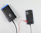 Zapping the iPhone 16's battery glue away. (Image source: iFixit)