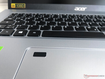 The touchpad also includes the fingerprint scanner.
