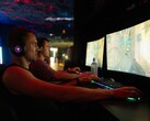 Playing at 480Hz is said to confer a signficant advantage over 60Hz. Gamers in front of monitors pictured.