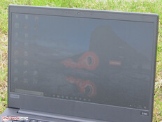 The ThinkPad outdoors (under a cloudy sky).