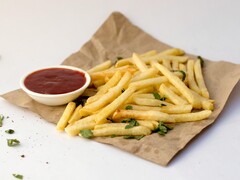 A serving of French fries and a bowl of sauce (Image source: Pixzolo Photography via Unsplash; cropped)
